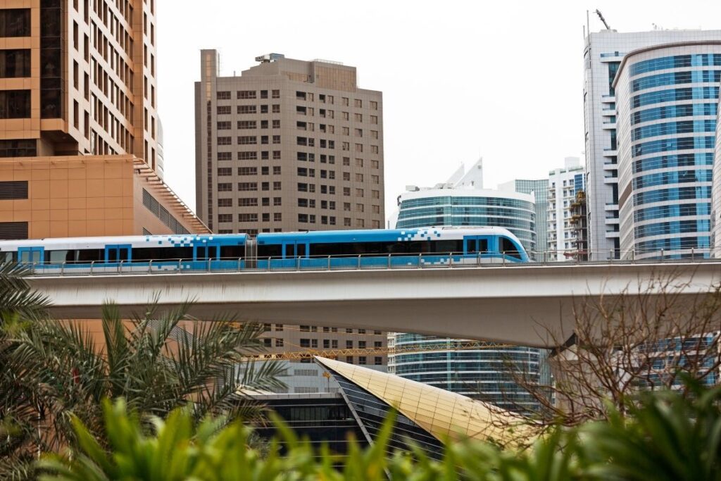 Dubai metro train in city showing public transport costs and daily commuting expenses