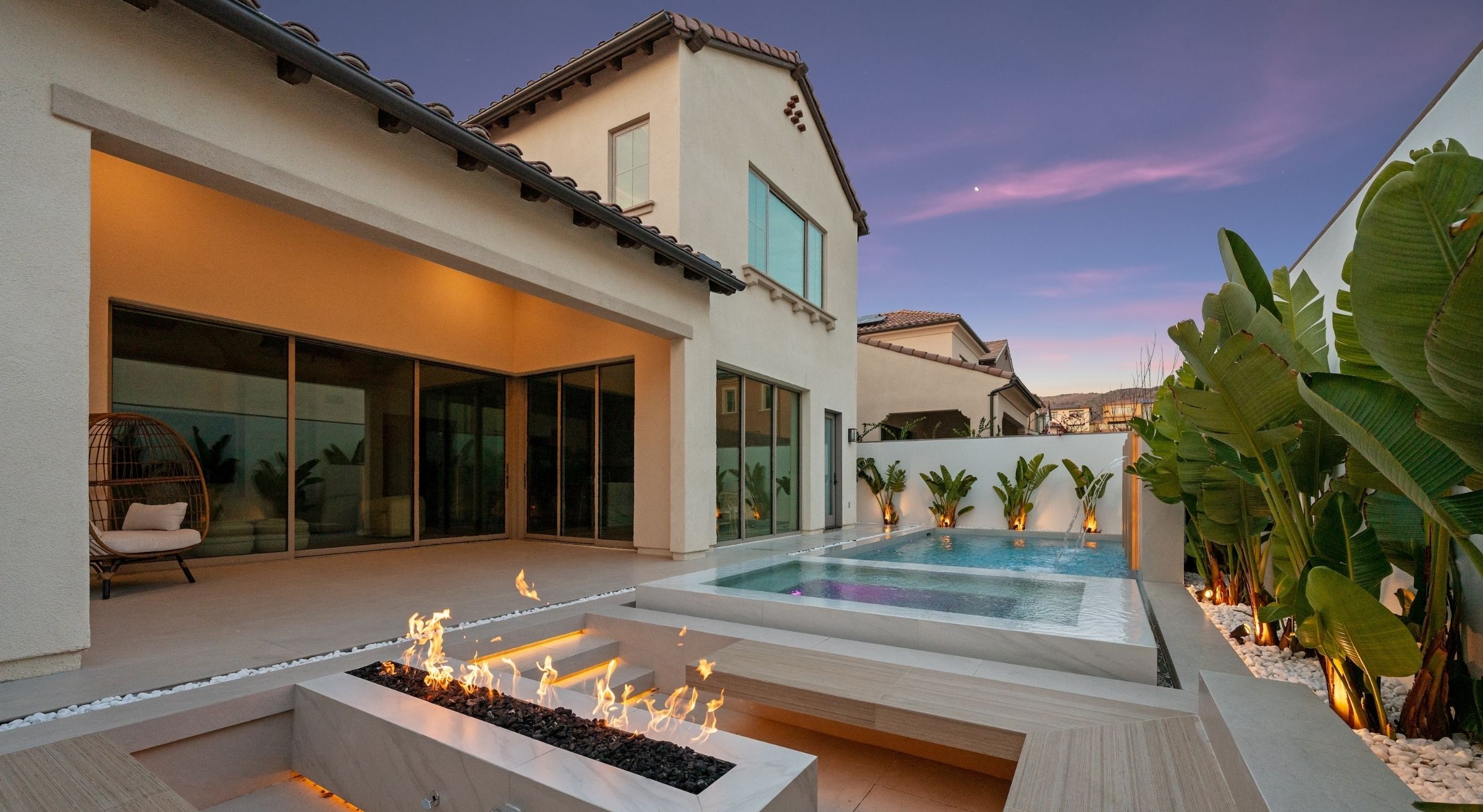 Buy house in Dubai luxury home with pool and modern architecture at sunset