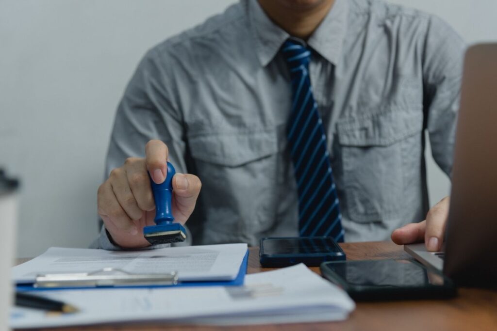 Documents being stamped for visa and relocation to Dubai
