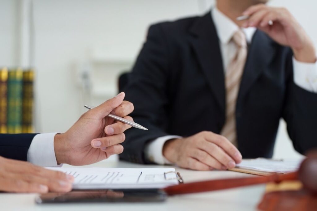 Business people signing contract related to Dubai visa and sponsorship