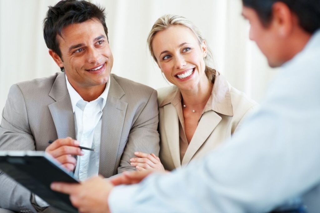 Couple consulting advisor about Dubai visa, residency and relocation